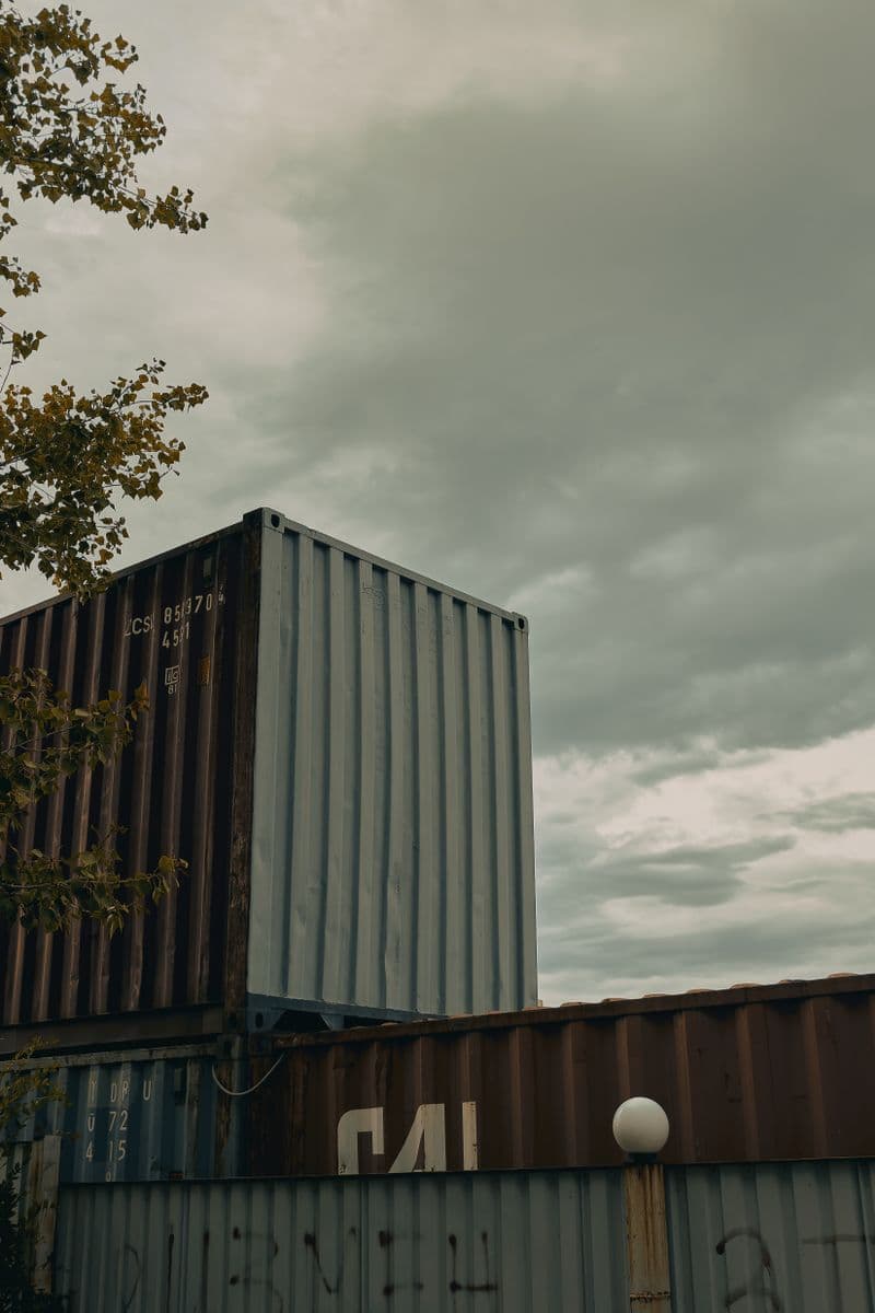 Stacked shipping containers in an industrial freight yard